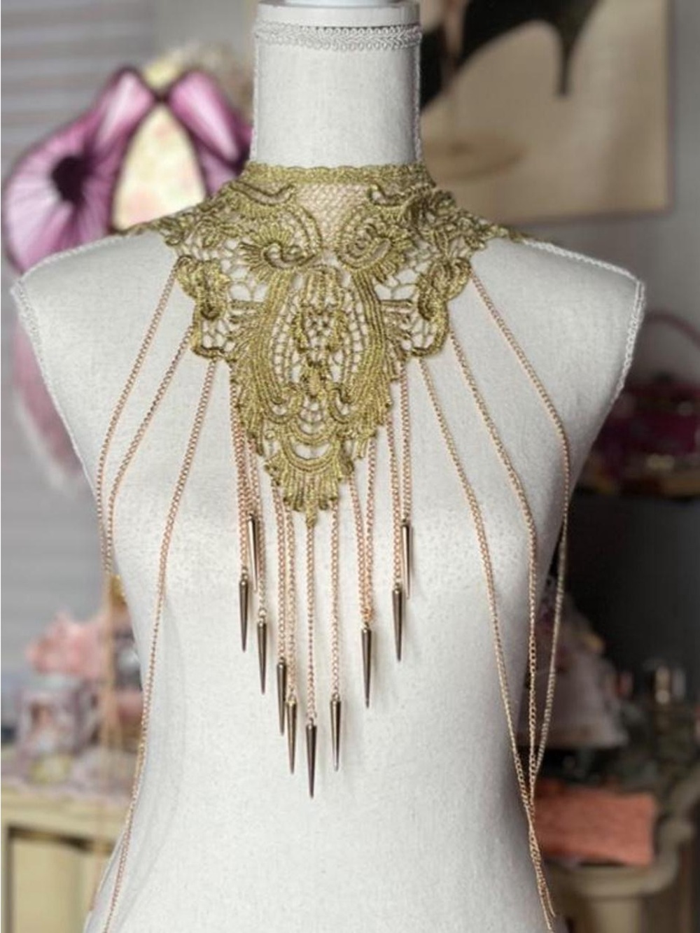 Gold ornate lace choker with dangling chains and spikes